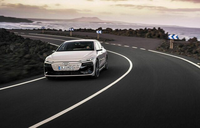 2024 Audi A6 e-tron luxury electric sedan in motion, showcasing its sleek design and sporty lines