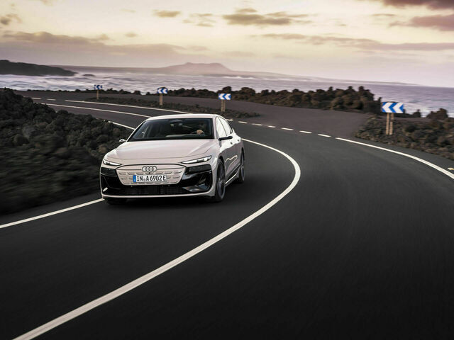 2024 Audi A6 e-tron luxury electric sedan in motion, showcasing its sleek design and sporty lines