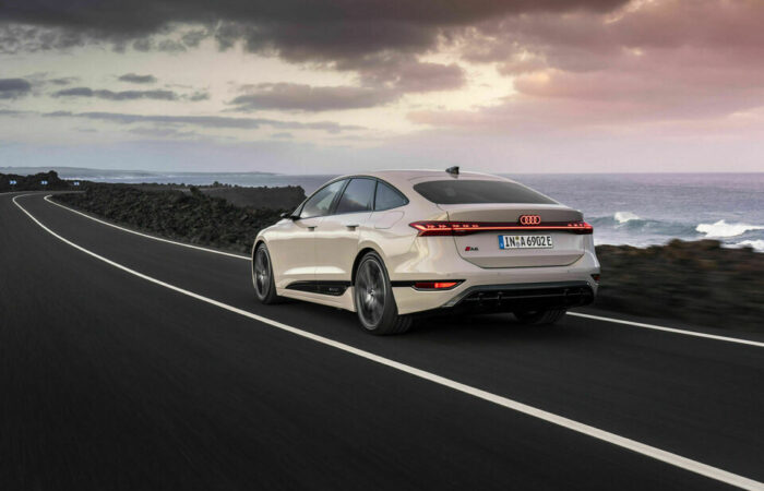 Audi A6 e-tron electric sedan in action, demonstrating its impressive range and dynamic performance on the road